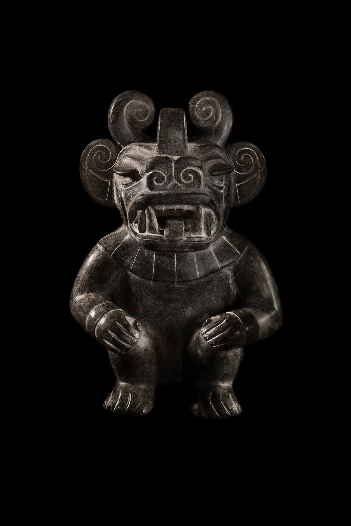 Aztec idol. Still life on a black background, Mudec collection. Photography Filippo Piantanida