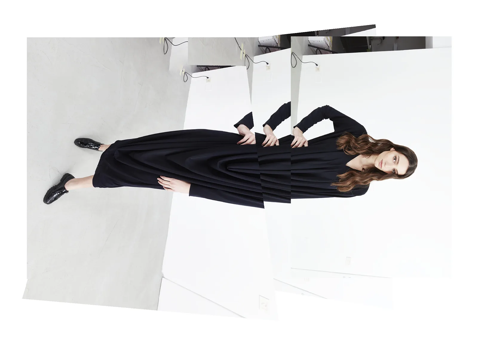 Experimental fashion lookbook: black tailored dress with a creative shot and photographic distortion